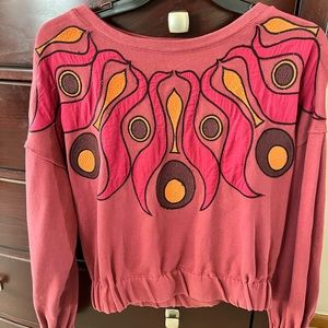 Embroidered oversized sweatshirt by Anthropologie.